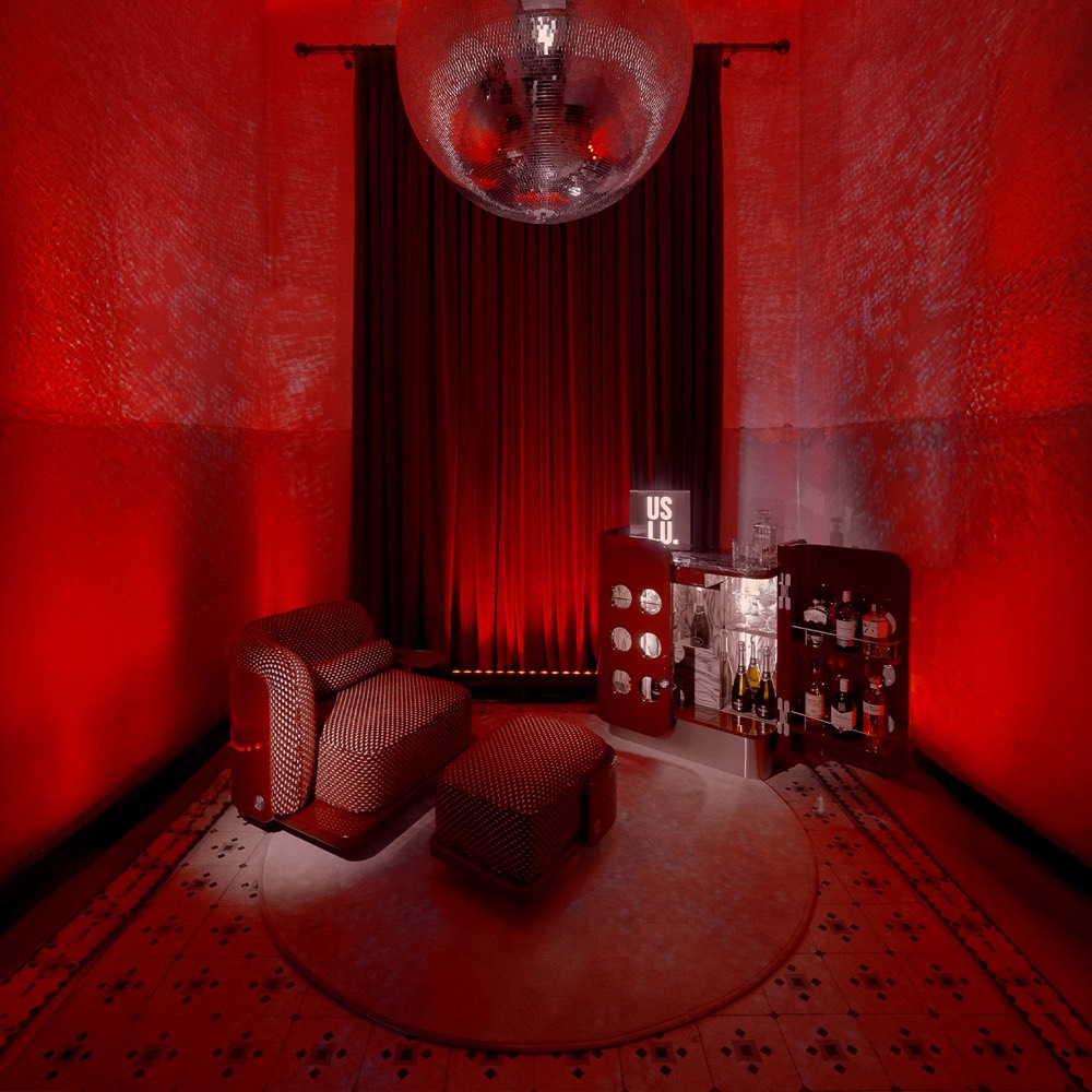 Disco House red room installation with The Laidback Lounge Chair and The Cuban Bar Cabinet
