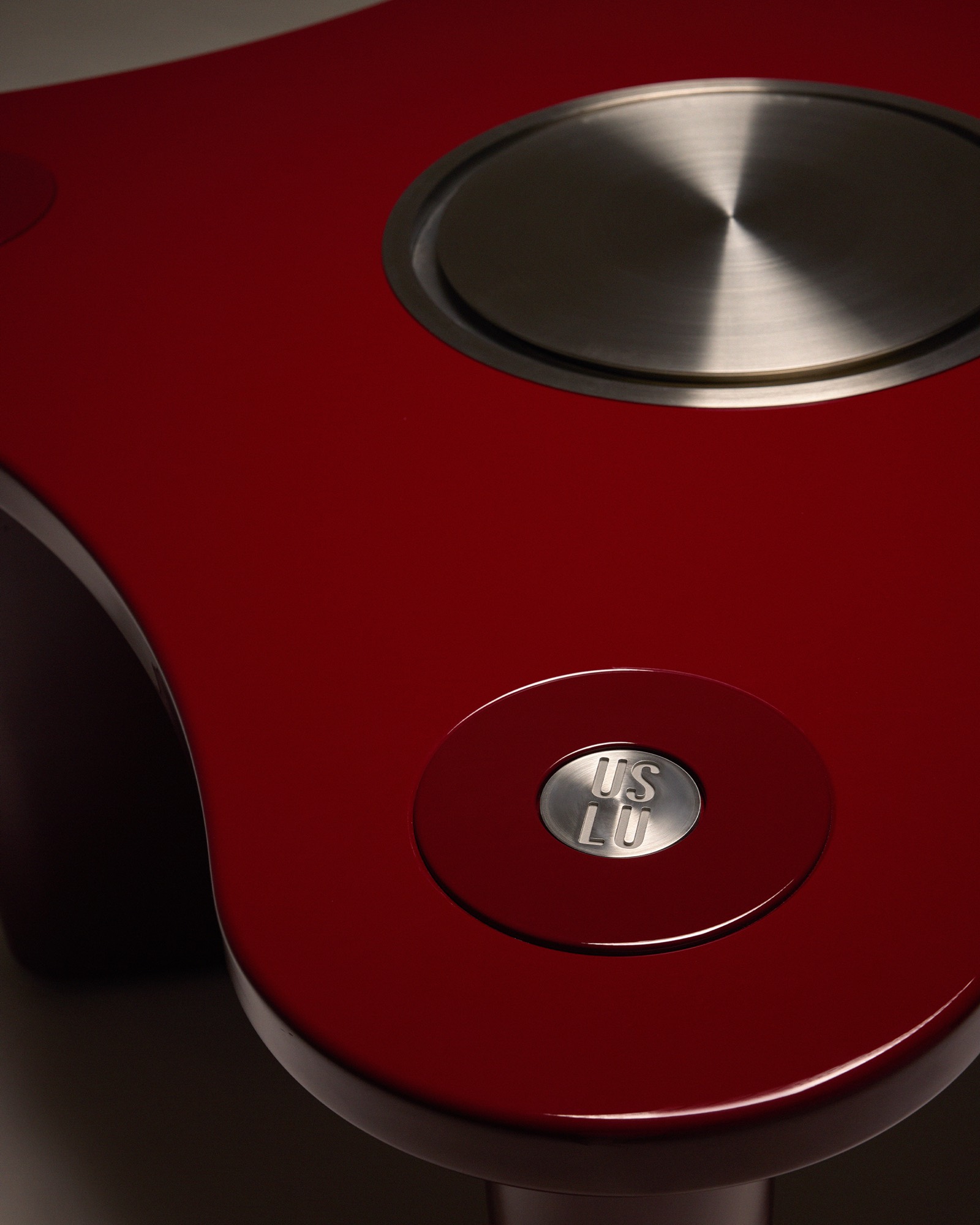 The Socialite Dining and Drinks Table, stainless steel detail with engraved logo